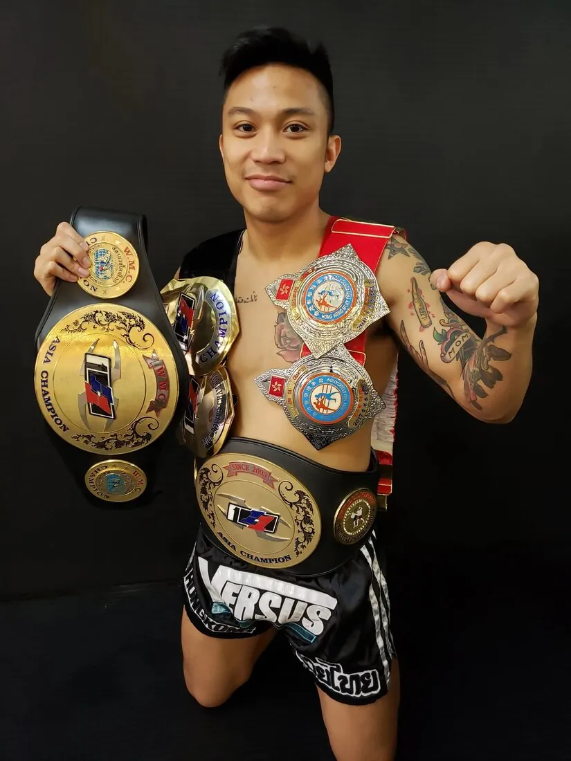 A Versus Performance fighter with championship belts